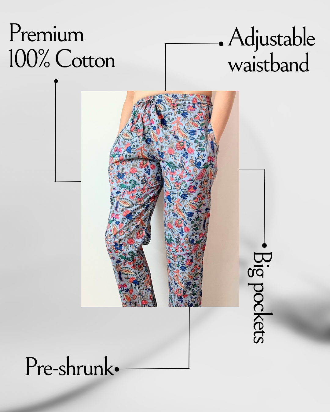 Comfy and stylish women’s sleep pants in pure cotton, featuring a pink flower print on gray, ideal for relaxing or a peaceful night’s sleep.