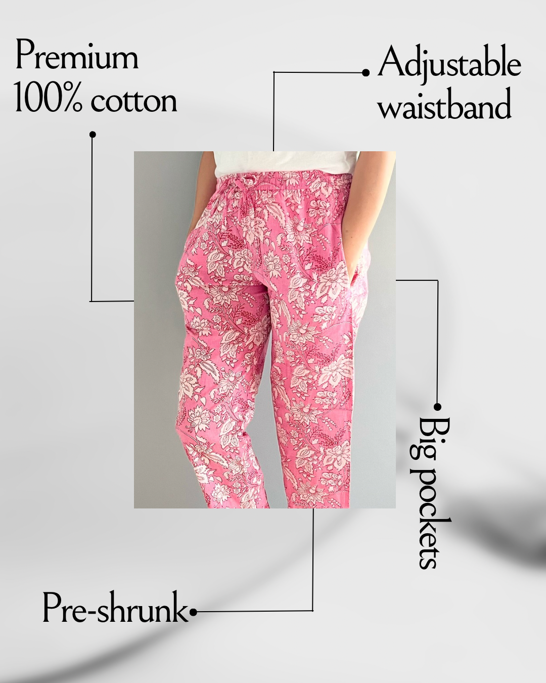 Women’s cotton pajama pants with a pink floral design, featuring pockets and an elastic waistband, ideal for lounging or sleeping in comfort.