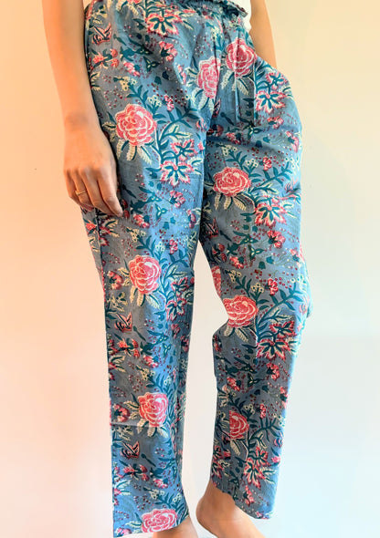 SEO Description: Elevate your sleepwear collection with this pack of 2 100% organic cotton pajama pants. Featuring a serene blue-gray design with pink flowers and a festive winter wonderland theme, these pants offer unmatched comfort and sustainability. Perfect for new moms, girls' trips, bridal showers, and more. Enjoy FREE SAME DAY shipping from a small business in North Carolina, USA.