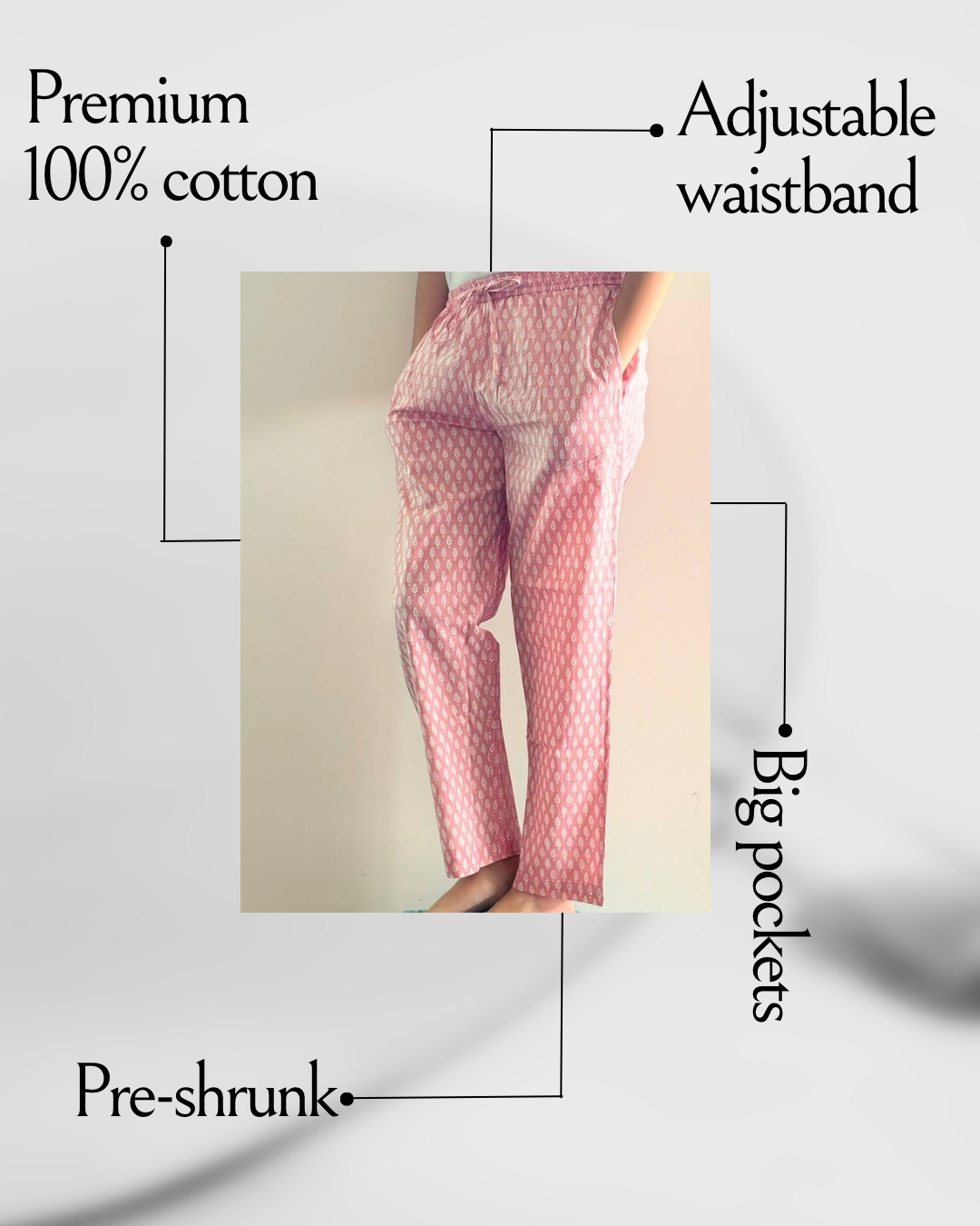 Soft and breathable women's 100% cotton pajama pants featuring a charming print of small white trees on pink, with an elastic waistband and pockets.