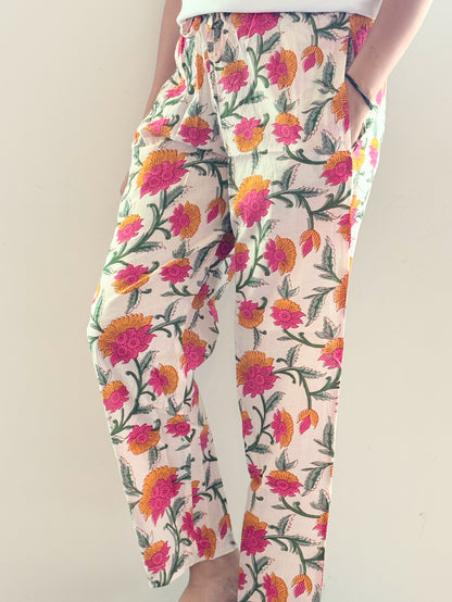 Soft cotton pajama pants for women with pink and orange floral print and elastic waistband