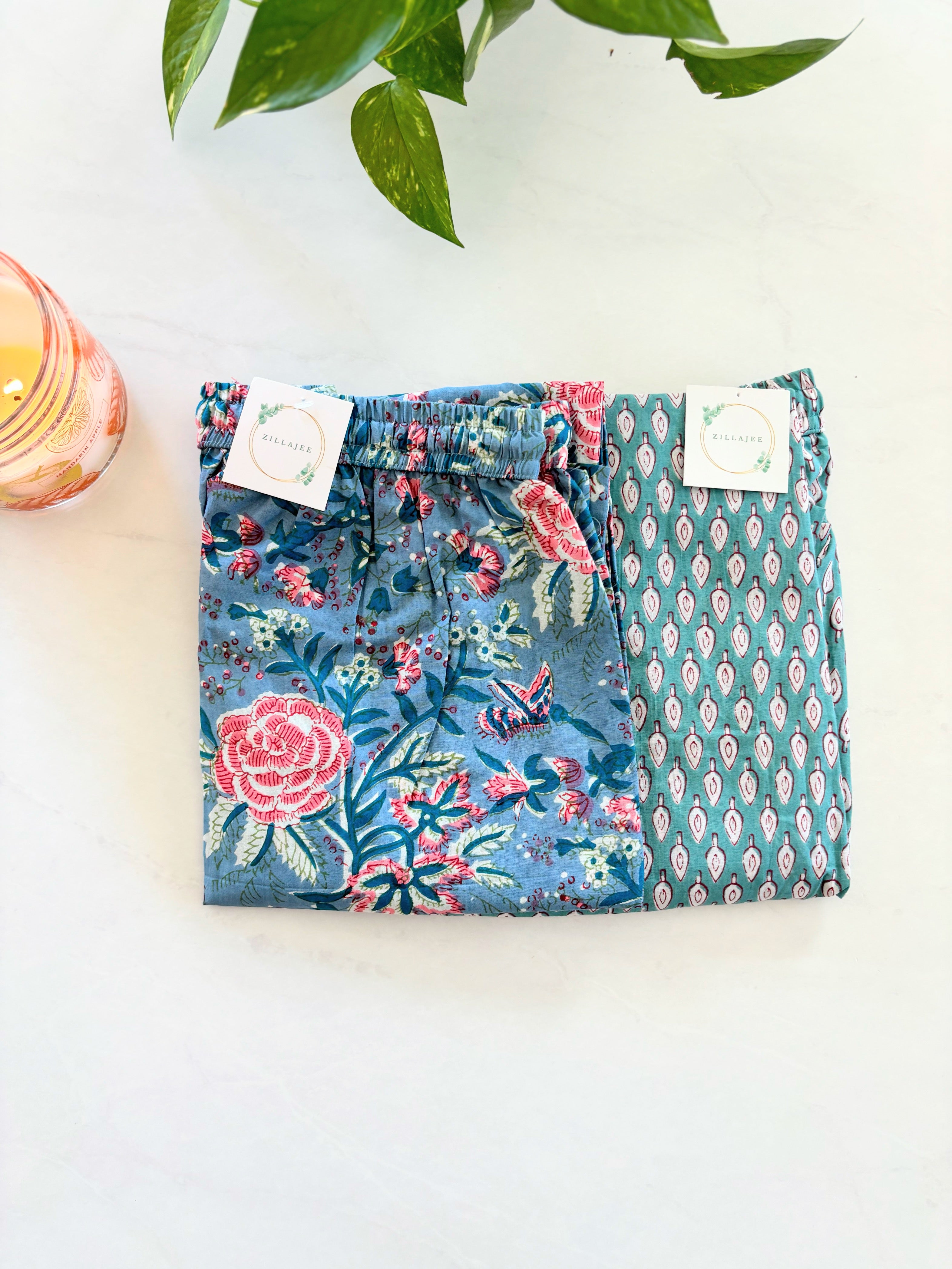 SEO Description: Elevate your sleepwear collection with this pack of 2 100% organic cotton pajama pants. Featuring a serene blue-gray design with pink flowers and a festive winter wonderland theme, these pants offer unmatched comfort and sustainability. Perfect for new moms, girls' trips, bridal showers, and more. Enjoy FREE SAME DAY shipping from a small business in North Carolina, USA.