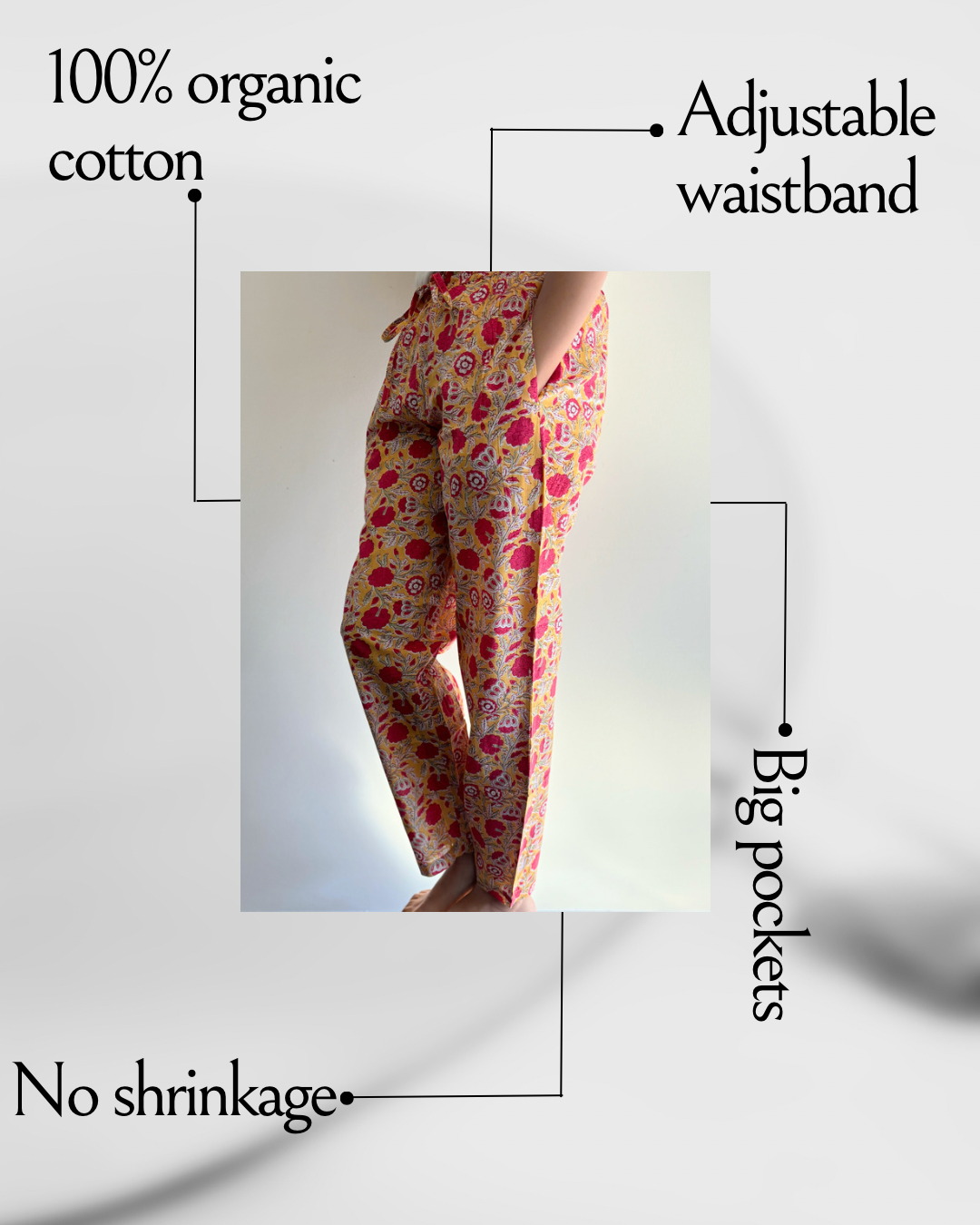 Women’s 2-pack cotton pajama pants featuring a red floral print on yellow and an orange floral design on navy blue, both with convenient pockets and elastic waistbands.