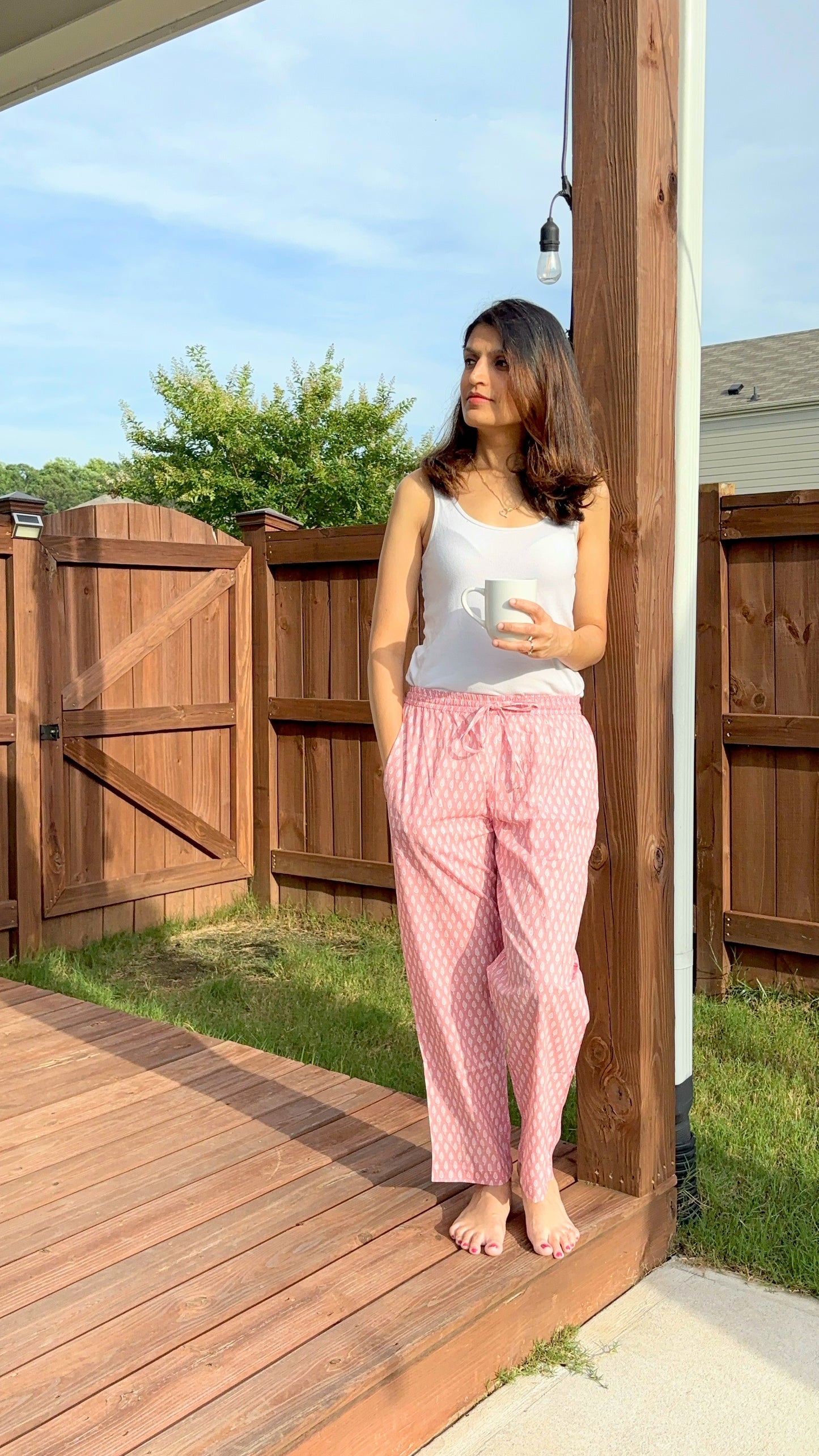 Cute and comfy sleep pants for women, featuring a small white tree pattern on a pink background, ideal for a cozy night in or lounging around the house.