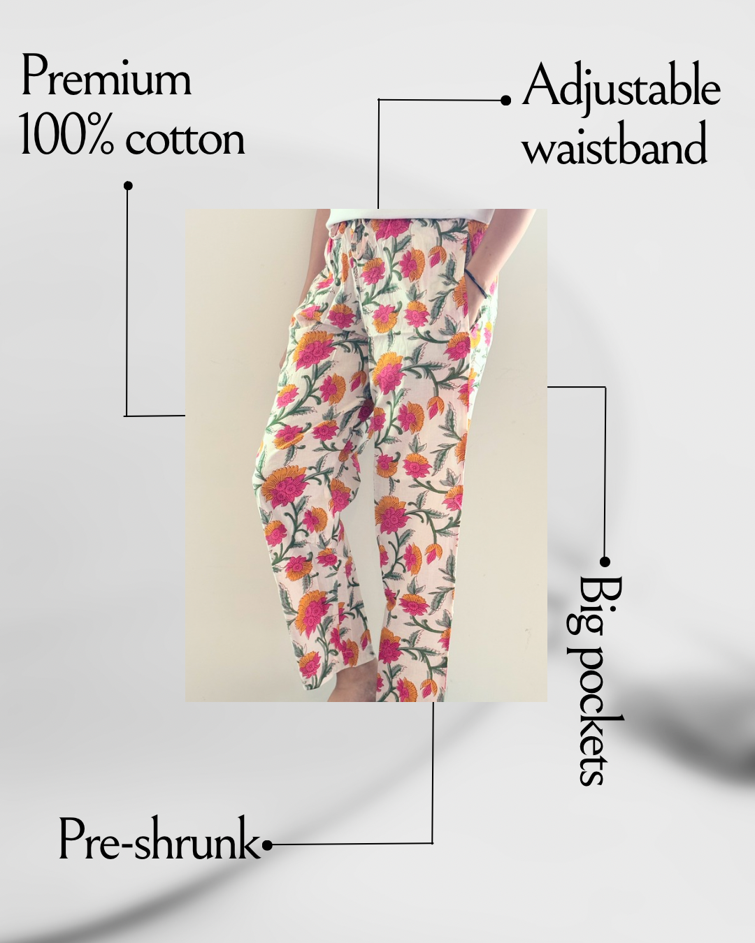 Floral print cotton lounge pants for women with pink and orange flowers on white fabric and pockets