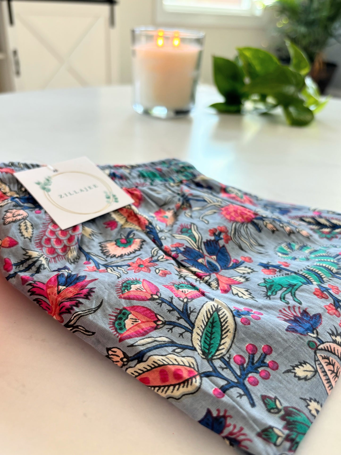 Eco-friendly ladies' sleepwear, made from pure cotton, with a delicate floral pattern of pink flowers on gray—comfortable, breathable, and perfect for lounging.