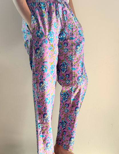 Soft 100% cotton women's lounge pants with blue floral print on lavender, featuring elastic waist and pockets