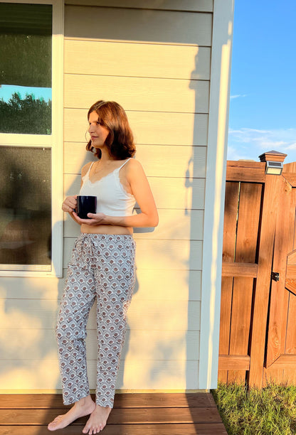 Two cotton pajama pants in grey and navy colors on a white background